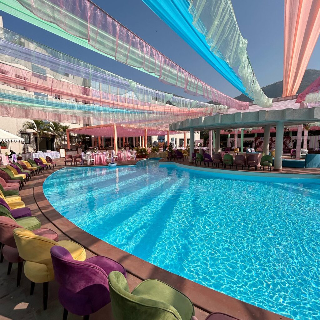 Colourful poolside lounge and floral event decor