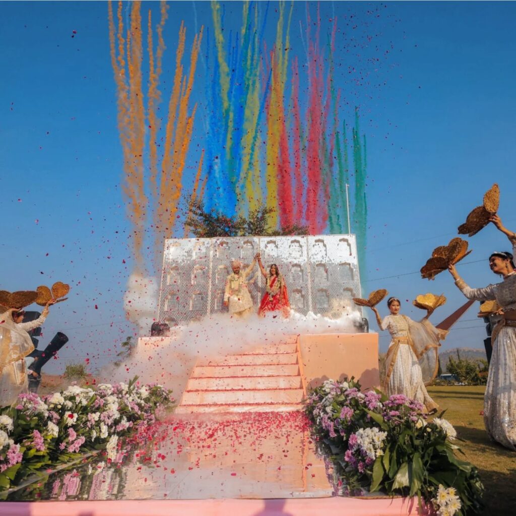 Daytime wedding stage with colourful suspended decor