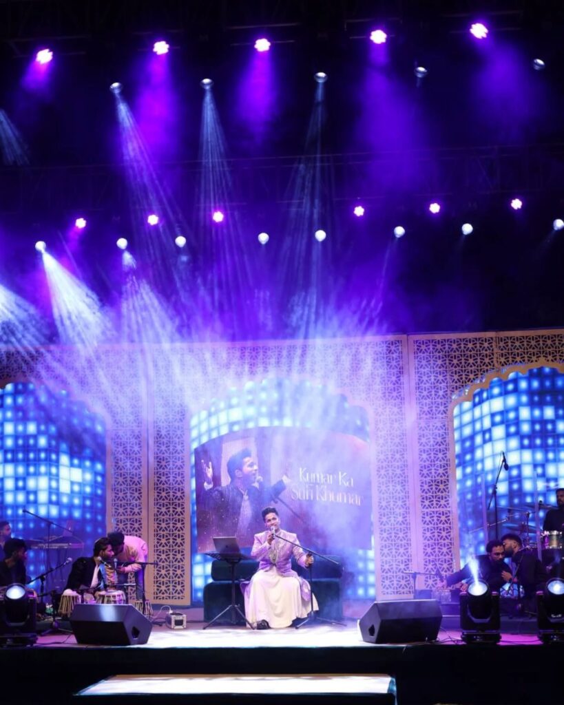 Purple-lit live entertainment stage at a wedding celebration