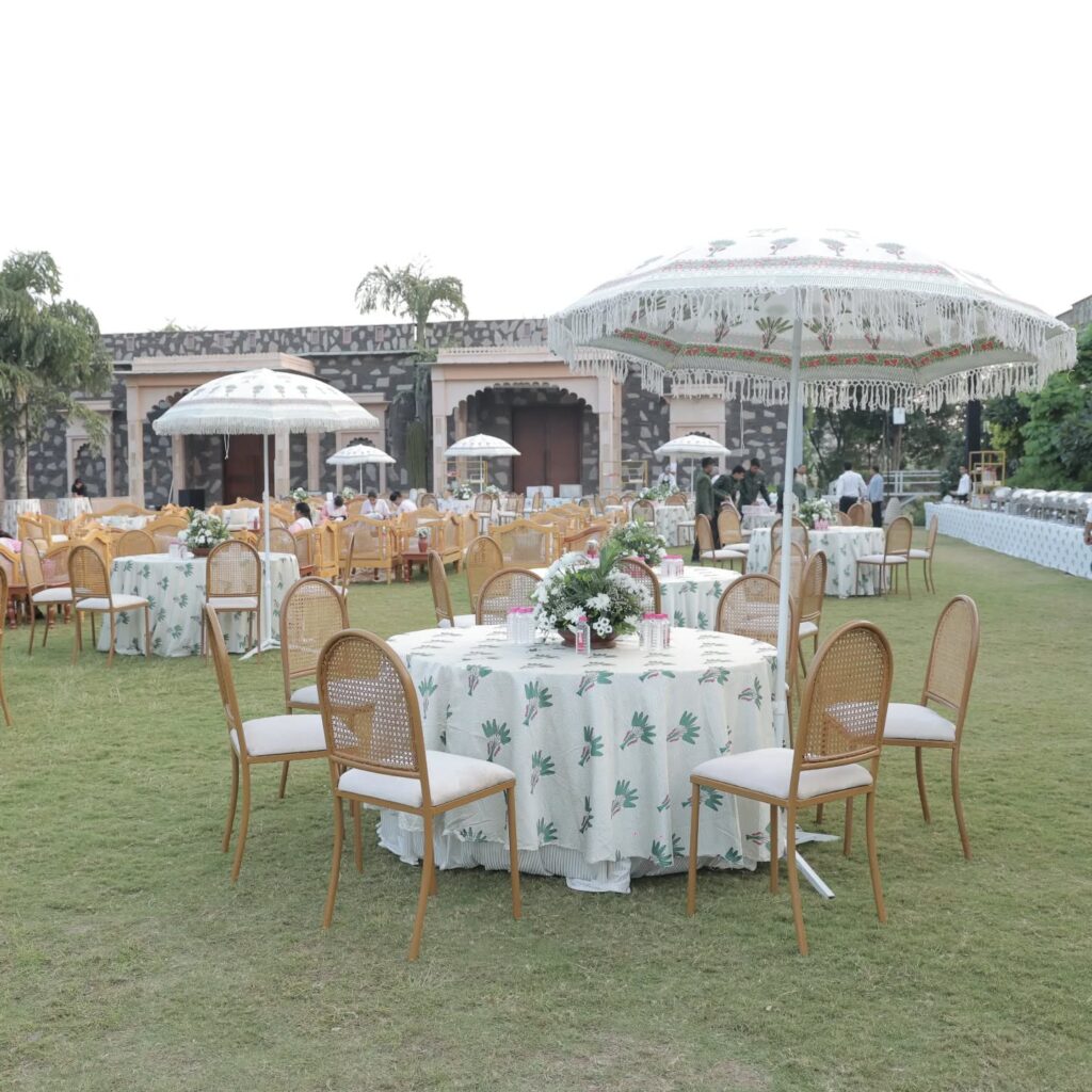 Outdoor wedding tablescape with white floral arrangements