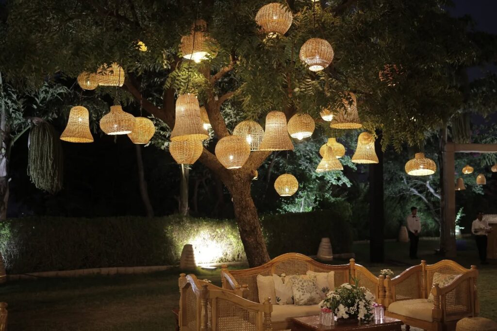 Warm woven pendant lights above an intimate wedding lounge
