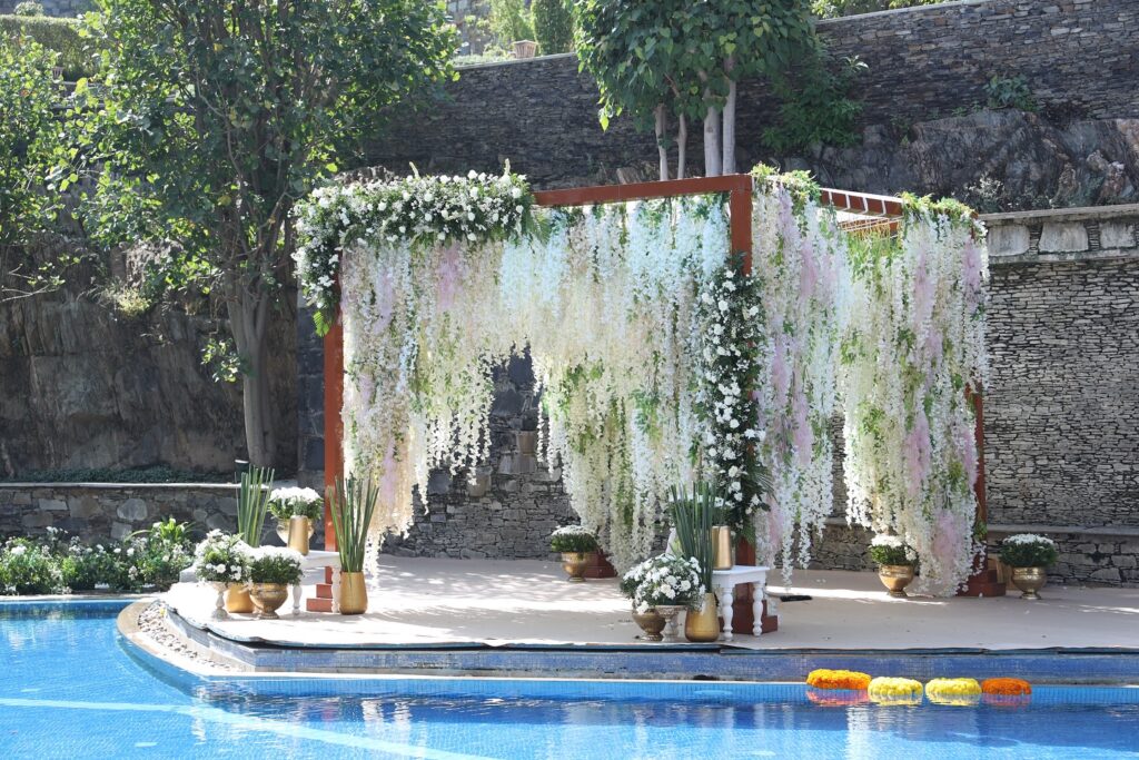 White floral poolside ceremony canopy